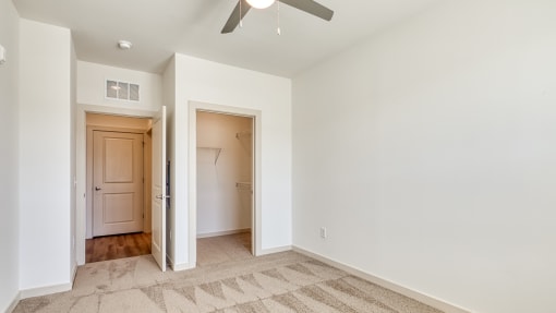 a renovated living room with white walls and a ceiling fan at The Walker Virginia Center, Virginia