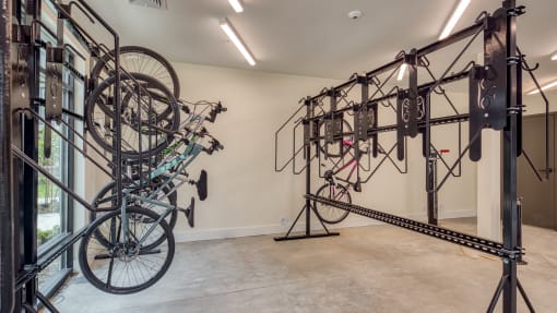 a room with a bikeousel and other bikes on a rack at Ainsworth, Richmond
