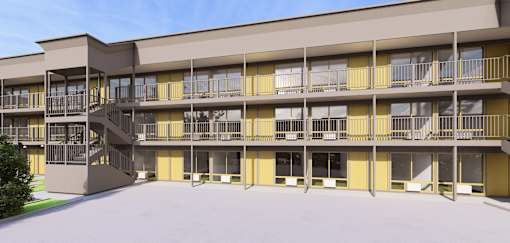 A large building with a lot of windows and balconies.