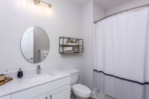 Featured model bathroom with tub and vanity Centro at Pine Nash, Wilson, NC
