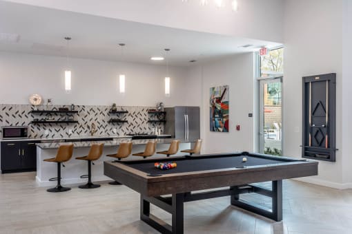 Enjoy a game of billiards at the Resident Lounge and Social Space Centro at Pine Nash, Wilson, NC