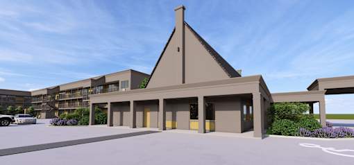 A modern building with a triangular roof and a parking lot in front.