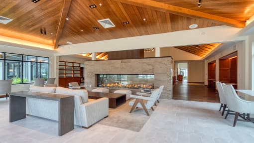 the living room has a fireplace and a large table with chairs at Ainsworth, Virginia