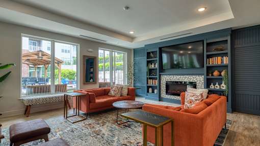A living room with a fireplace and a television.