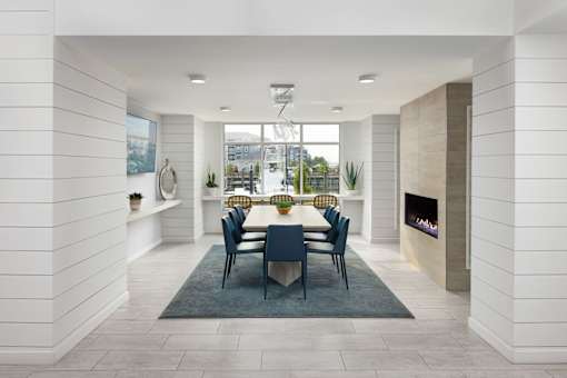 A dining room with a table set for six.