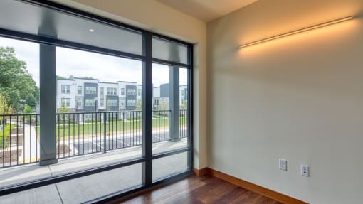 a living room with large windows and a balcony at Ainsworth, Virginia, 23228