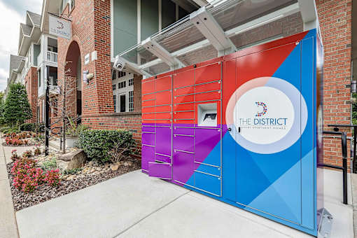 A colorful gate with The District on it.