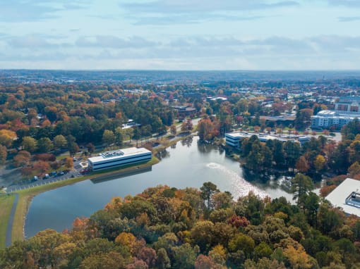 an aerial view of a city with a river and treesat Metropolis Apartments, Virginia
