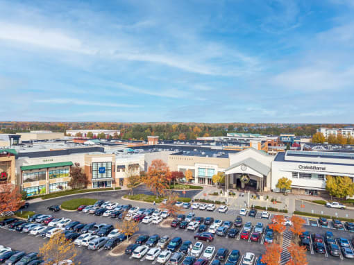 an aerial view of a shopping mall and parking lot at Metropolis Apartments, Glen Allen, 23060