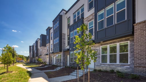 a row of apartment buildings on a sunny day at Ainsworth, Richmond, 23228