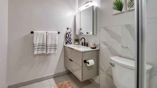 Walk-In Showers With Built-In Bench And Glass Enclosure at Residences at Richmond Trust, Richmond