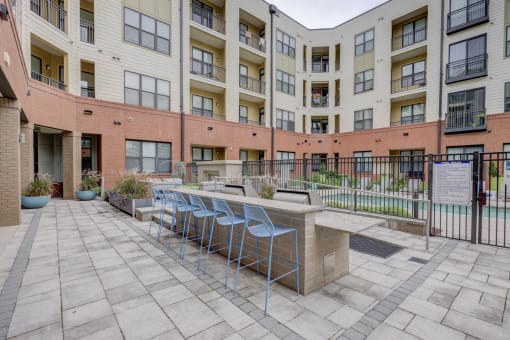 Outdoor Grill With Intimate Seating Area at The Lincoln Apartments, Raleigh
