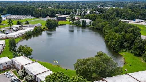 A large lake surrounded by buildings and trees.