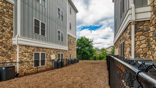 the preserve at ballantyne commons apartments courtyard and stone building