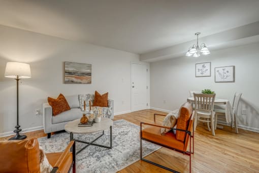 an open living room and dining room with a table and chairs