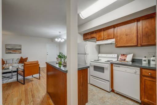 a kitchen with white appliances and wooden cabinets