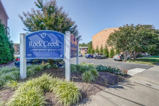 the rock creek sign at the entrance apartments