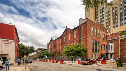 a large brick building with a fence in front of it
