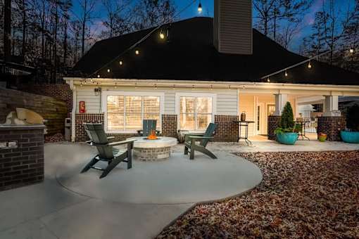 A house with a patio and a fire pit.