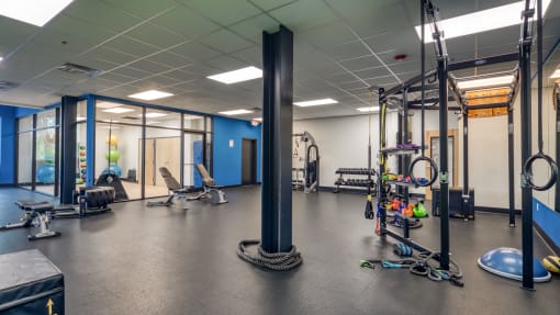 a workout room with weights and other exercise equipment  at The Hudson, Richmond, Virginia