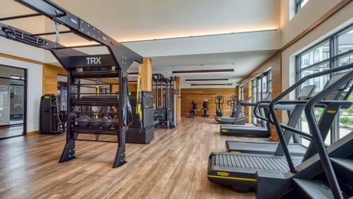 a gym with weights and cardio equipment on the floor and a window at Ainsworth, Virginia, 23228