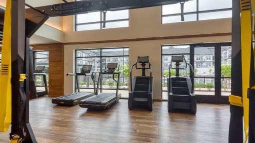 a gym with cardio equipment and windows in a building at Ainsworth, Richmond