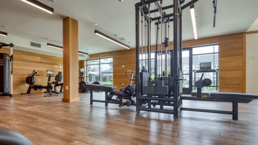 a gym with weights and other exercise equipment on a wooden floor at Ainsworth, Virginia
