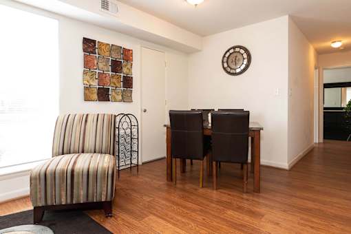 A room with a brown chair and a brown table.