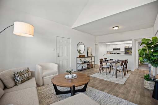 A living room with a couch, chair, and coffee table.