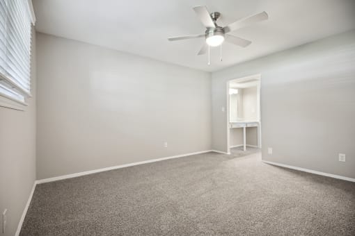 an empty room with carpet and a ceiling fan at Shellbrook, North Carolina, 27609