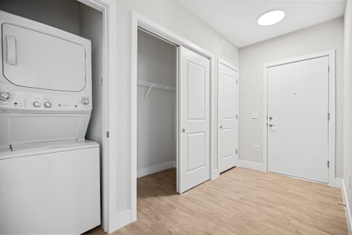 Front entry featuring convenient coat closet storage and in-unit washer and dryer  Centro at Pine Nash, Wilson, NC