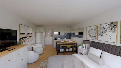 A modern living room with a white couch and a wooden table.