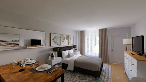 A well-lit bedroom with a bed, a desk, and a dining table.