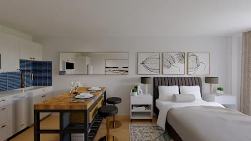 A modern bedroom with a large bed and a kitchen area.
