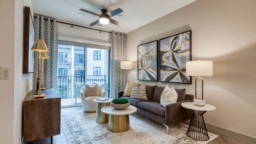 a living room with a couch and a ceiling fan at Aura Stonebridge, Richmond, VA 23225