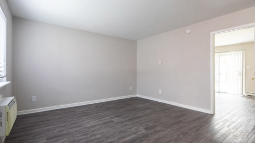 A room with a window and a door.