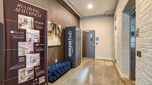 A hallway with a sign that says "Riveting at its finest" and a blue sofa.