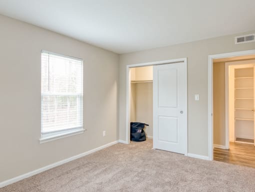 Carpeted bedrooms at Colonial Towne Apartments