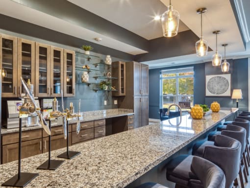 a kitchen with granite counter tops and a long island