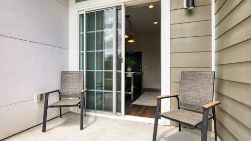 Two chairs are placed on a patio.