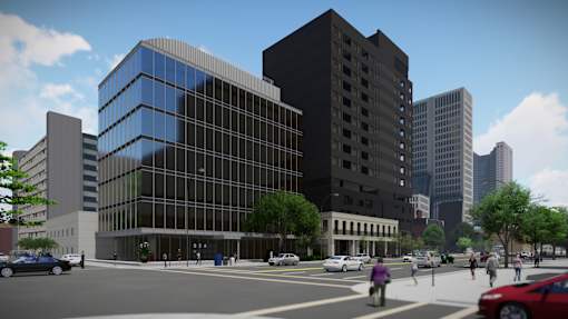 a rendering of a large office building on the corner of a city street