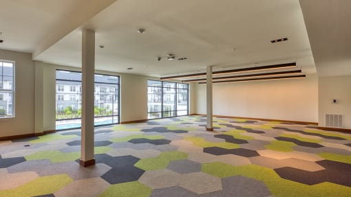 a large room with a colorful carpet in the middle of it at Ainsworth, Richmond, Virginia