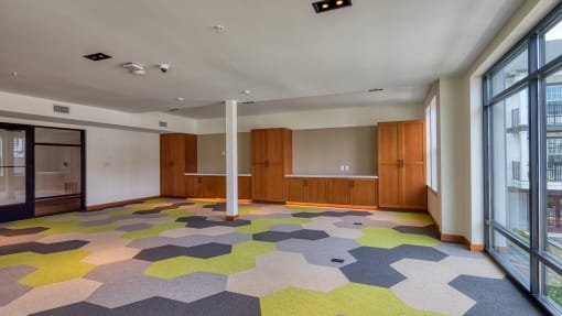 a large room with a colorful carpet and large windows at Ainsworth, Richmond, Virginia