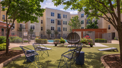 a courtyard with tables and chairs at Proximity at ODU, Virginia, 23508