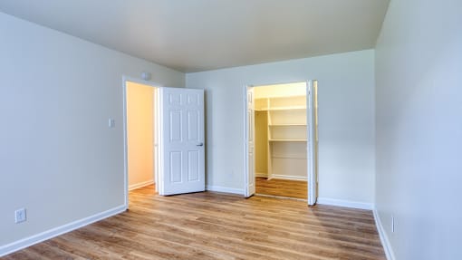 an empty room with a closet and an open door at Gates of West Bay in Norfolk, 23503