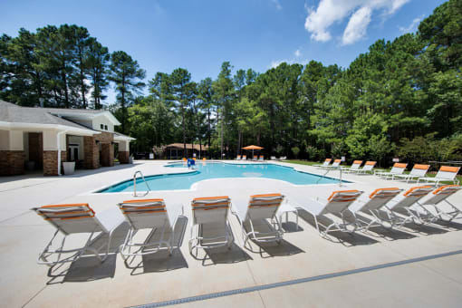 Swimming Pool with Lounge Chairs at Shellbrook Apartments in Raleigh NC