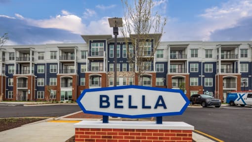 an arrow sign in front of an apartment building at The Bella at Westchester, Midlothian, VA, 23113