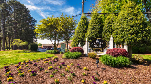 an image of the colonial pines sign in front of the property