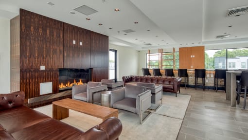 a living room with couches and chairs and a fireplace at Ainsworth, Richmond
