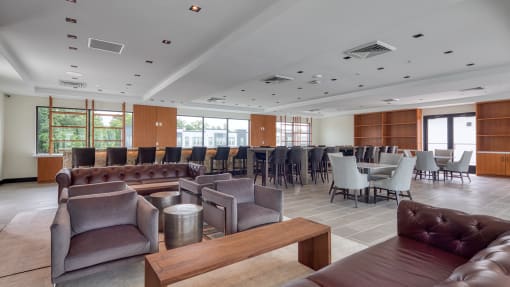 a large room with couches and chairs and tables and chairs at Ainsworth, Richmond